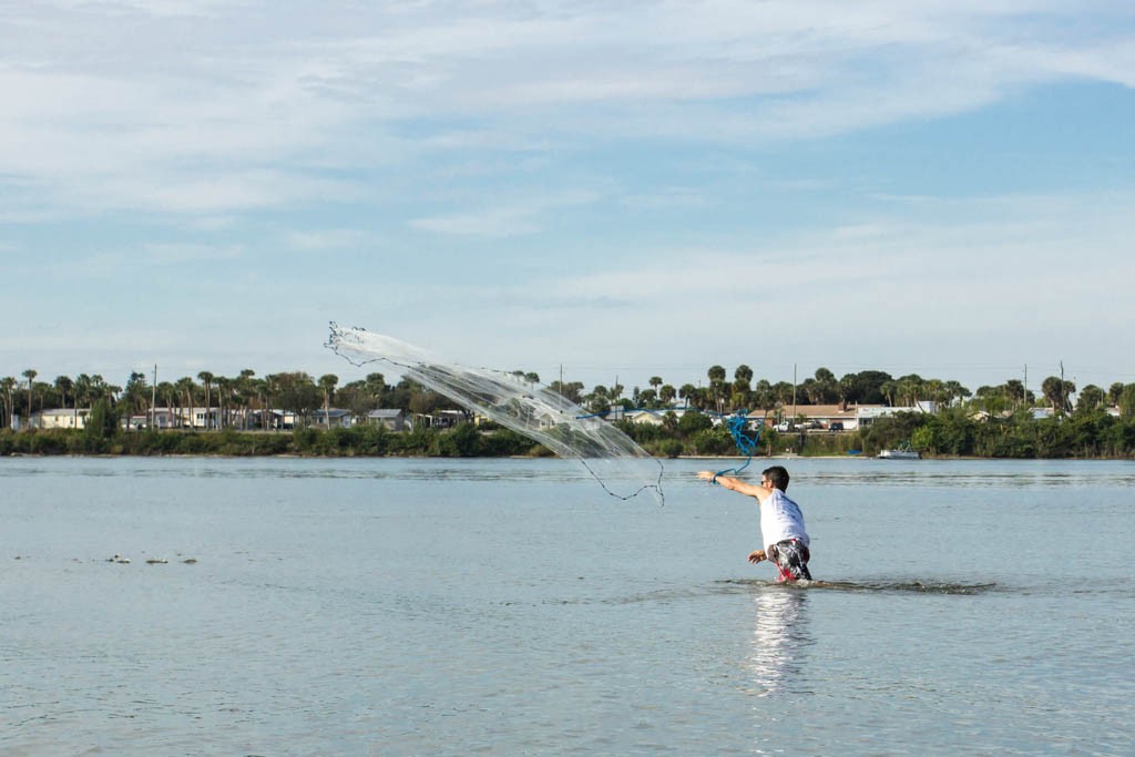 Ian using a castnet for bait