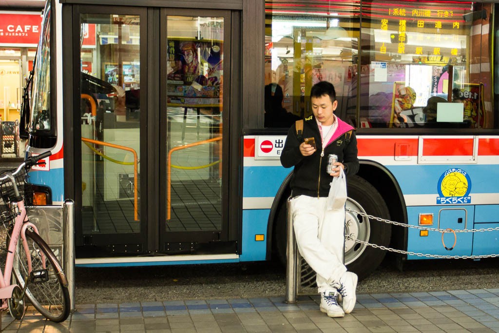 Guy waiting for the bus.