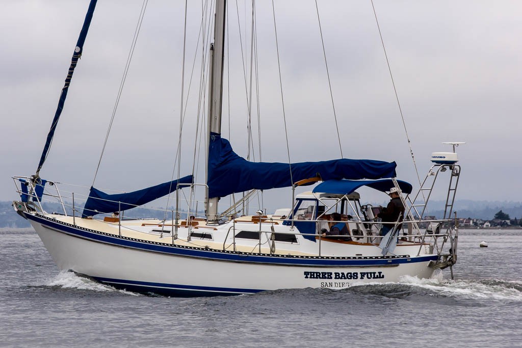 Action shots of a passing sailboat.