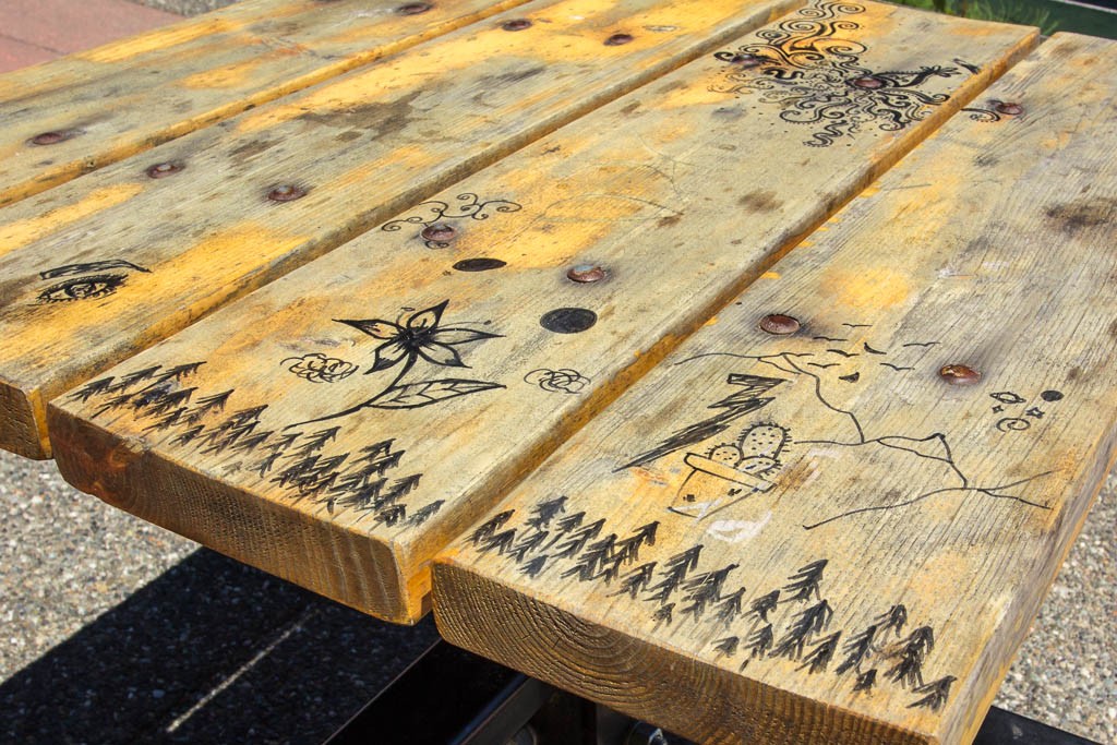 Pen doodles on the picnic table.