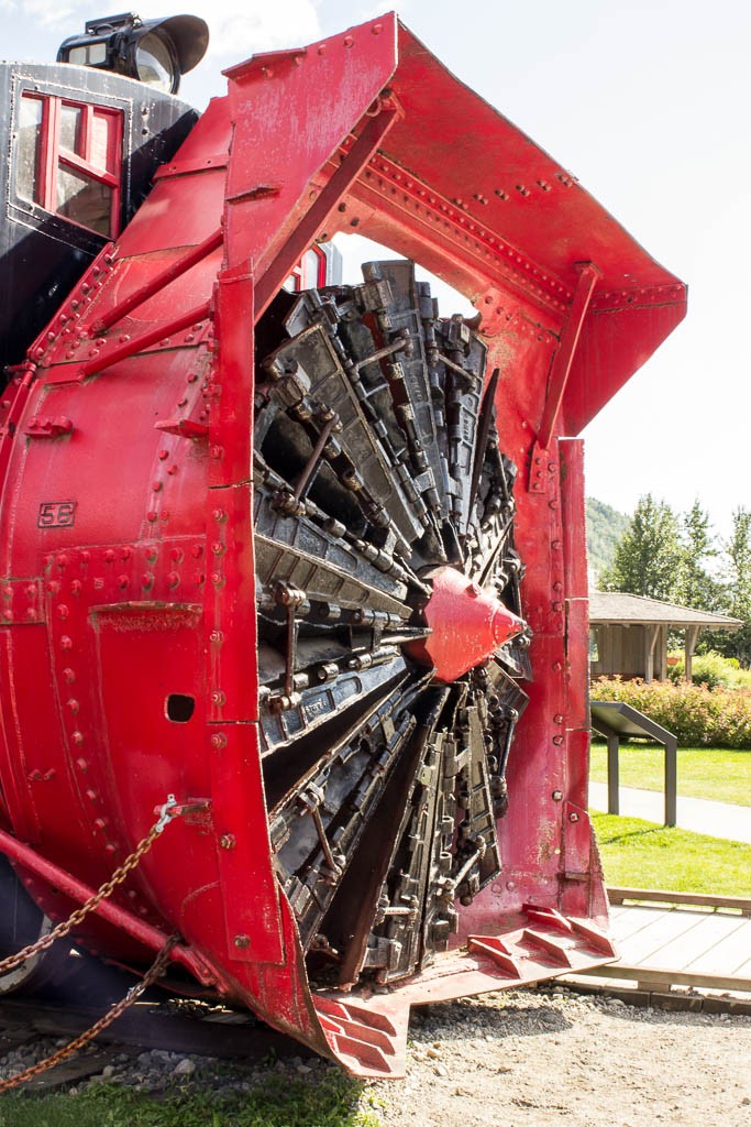 Snow plow on the front of a train.