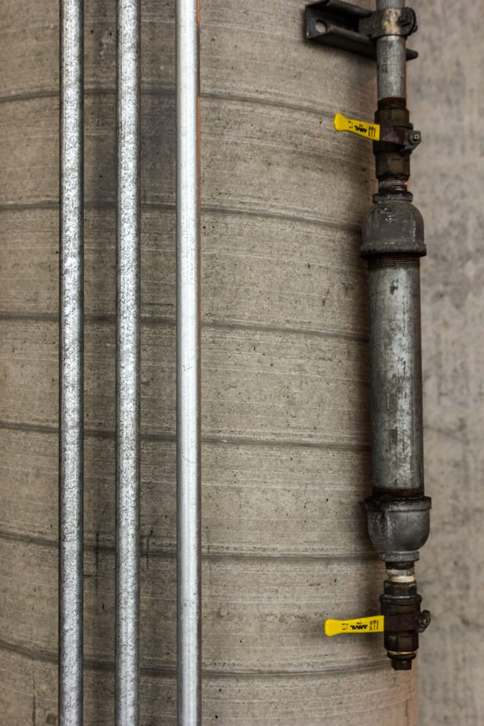 Water line and electrical conduit in a semblance of pleasant composition