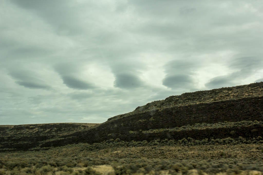 An entire row of lenticular clouds... wonder what caused that!