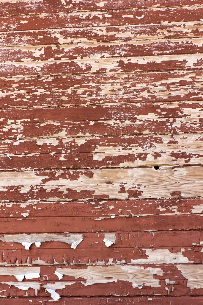 Peeling and faded red paint