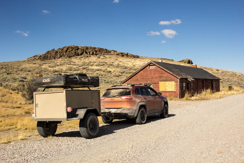 Jeep next to an old barn