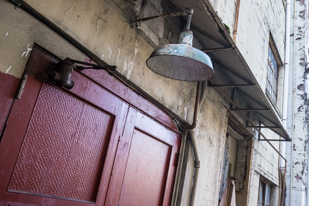 This shows how you can use a wider angle lens and perspective to change the feel of a shot. This isn't a portrait of the lamp against the red door.