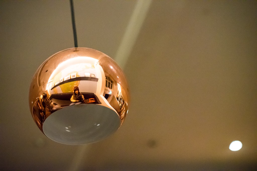 Self portrait in the lamp at the coffee shop.