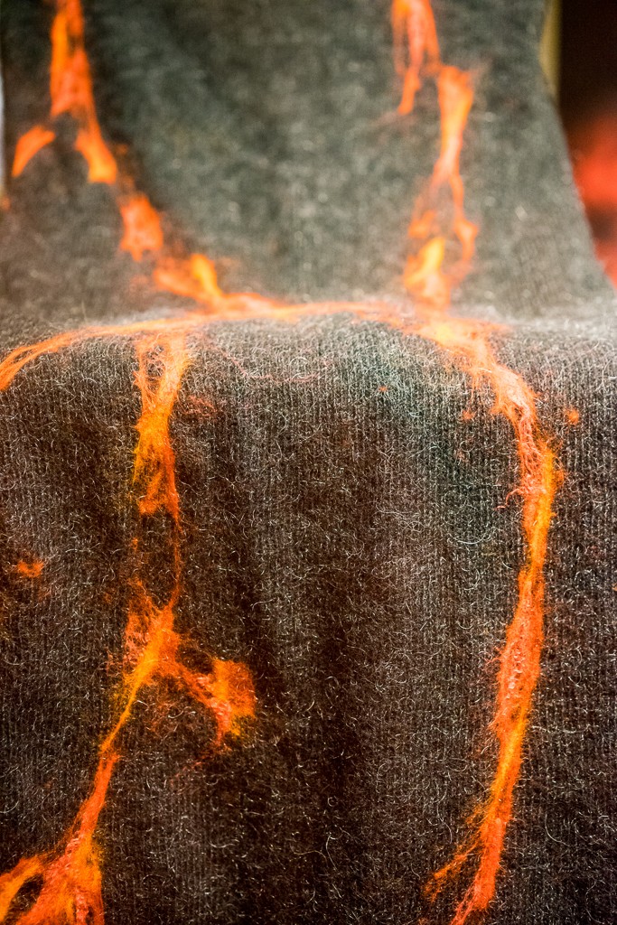 Iceland has a lot of sheep and therefore a lot of wool items.  This blanket had fire sewn onto it! cool!